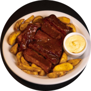 Entrada: PORK RIBS e 300G Batata Rústica - 400 g Costelinha suína defumada com molho barbecue da casa acompanhada de 300g batata rústica e maionese da casa.