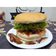 Lanches: X Bacon - Lanche (Ingredientes: Alface, Bacon, Hambúrguer Artesanal!, Mussarela, Ovo, Presunto, Queijo)