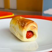 Salgados: Enrolado de Salsicha Assado - Envio sujeito a disponibilidade - Salgado de Trigo Assado com Salsicha