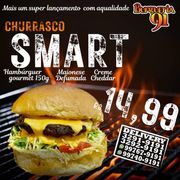 Hambúrguer Caseiro NA BRASA: Churrasco SMART - LANCHE (Ingredientes: Adc Hamb. cas. 150grs assado churrasco, Alface, Batata Palha, Creme de Cheddar, Maionese Defumada, Pão Tradicional, Tomate)
