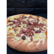 Tradicionais: BACON - Pizza (Ingredientes: Azeitonas, Bacon, Molho de tomate artesanal, Mussarela, Orégano)