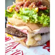 Hambúrguer: N-07-TUCO - Hambúrguer (Ingredientes: Alface, Bacon, Batata, Carne, Milho, Ovo, Pão, Presunto, Queijo, Tomate)
