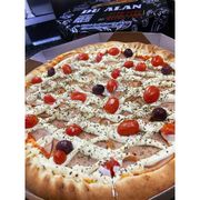 Premium: PEITO DE PERU PREMIUM - Pizza (Ingredientes: Azeitonas, Cream Cheese, Molho de tomate artesanal, Orégano, Peito de Peru, Tomate Cereja)