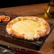 Salgadas: Mussarela - Esfiha Salgada (Ingredientes: Mussarela)