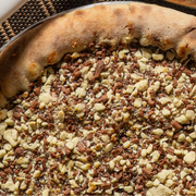 Doces: Ovomaltine - Pizza Grande (Ingredientes: Chocolate mesclado, Ovomaltine)