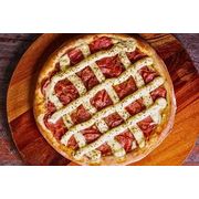 Tradicionais: Calapiry - Grande (Ingredientes: Massa Artesanal, Molho do Cheff, Mozzarella, Calabresa, Cebola, Catupiry, Orégano, Azeitona)