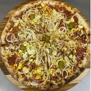 Tradicionais: Baiana - Pizza Grande (Ingredientes: Calabresa Moída, Pimenta, Ovos, Cebola, Orégano, Azeitona)
