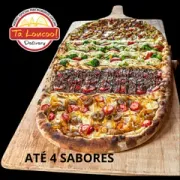 PIZZA TREM 4 Sabores: Baiana - PIZZA TREM 4 Sabores (Ingredientes: Azeitona, Calabresa, Molho Artesanal, Mussarela, Orégano, Ovo, Pimenta Biquinho)