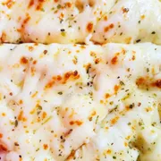 Tradicionais: 27 - Palmito com Catupiry - Pizza Grande (Ingredientes: Catupiry, Cebola, Molho de Tomate, Mussarela, Palmito)