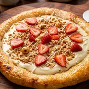Edicao Limitada Mes das Mulheres: Esf Ferreiro Ninho e Morangos - Esfiha aberta de creme de leite ninho com amendoas trituradas deliciosamente crocante e fatias selecionadas de morango (fina camada de mussarela na base)