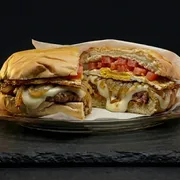 Lanches: X-Paulista - Lanches Simples (Ingredientes: Pão de Hambúrguer, Maionese, Tomate, Hambúrguer, Cebola na chapa, Ovo, Queijo)