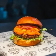 Hambúrguer: Mexicano - Hambúrguer (Ingredientes: Pão brioche com gergelim, Hambúrguer Angus 160g, Queijo Cheddar Cremoso, Doritos, Geléia de Pimenta Especial, Cebola Roxa, Alface Americana)