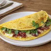 Crepiocas: Crepioca de Carne Seca - Seven + Fit (Ingredientes: Carne Seca, Cream Cheese, Queijo Parmesão)