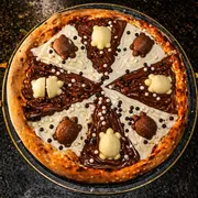 Doces: Tortoguita - Pizza Grande (Ingredientes: Cereal Ball, Chocolate ao Leite, Chocolate Branco, Tortoguita)