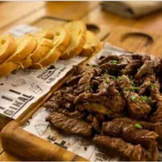Porção: Tiras de Alcatra Grelhada - Porção (Ingredientes: )