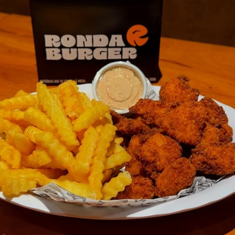 Porções: Porção Batata + Chicken Bites - Uma combinação perfeita com batatas e frango crocantes.