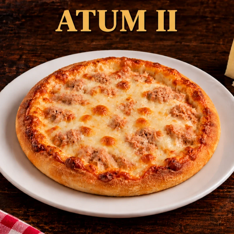 Esfihas Salgadas: Esfiha Atum 2 - Saboreie nossa Esfiha Atum II: massa fofinha e suavemente adocicada, coberta com atum marcante e muçarela cremosa em uma união deliciosa e memorável.